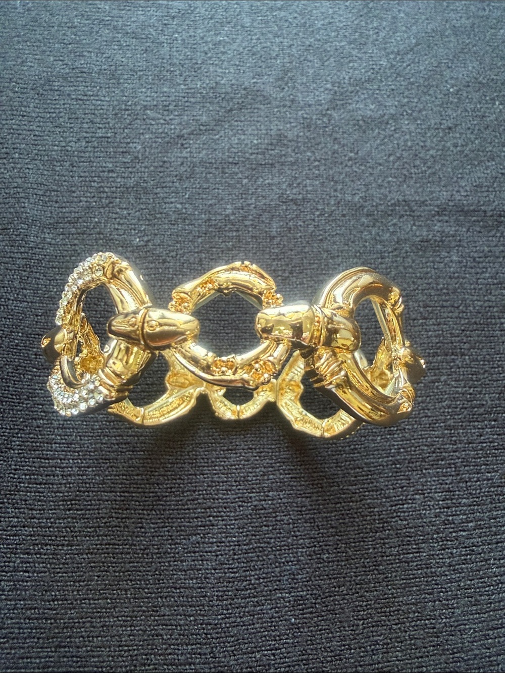 Gold Tone Linked Snake Bracelet with Crystal Accent